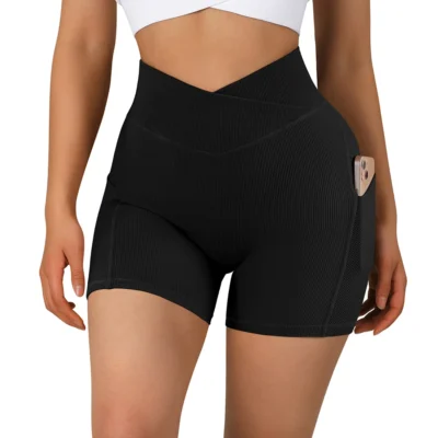 Woman wearing black cross waist shorts