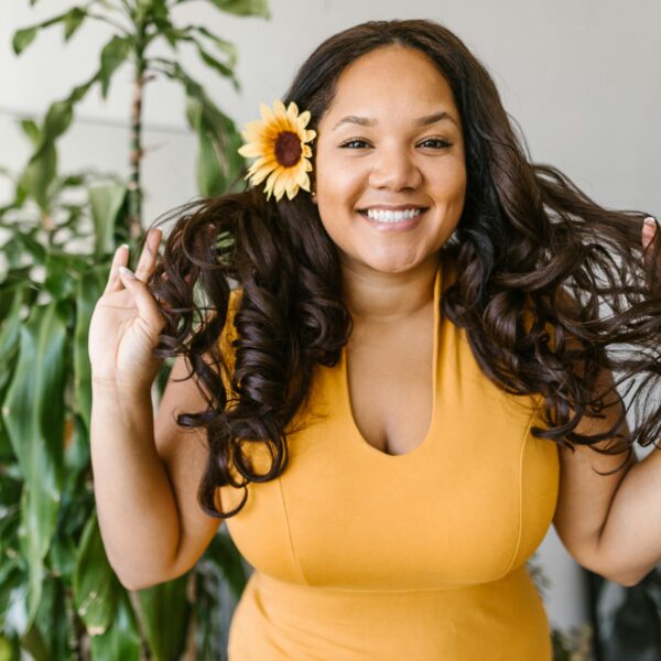 Woman in Yellow Dress Holding Her Hair