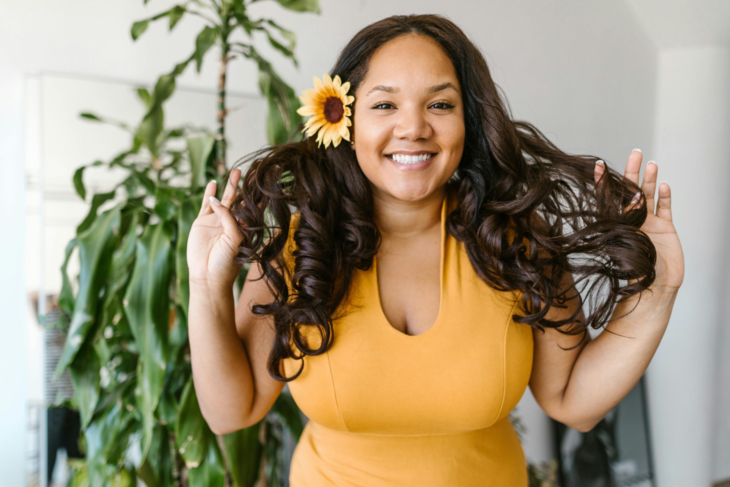 Woman in Yellow Dress Holding Her Hair